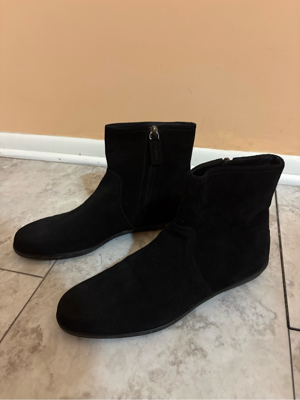 Tod’s black suede ankle boots